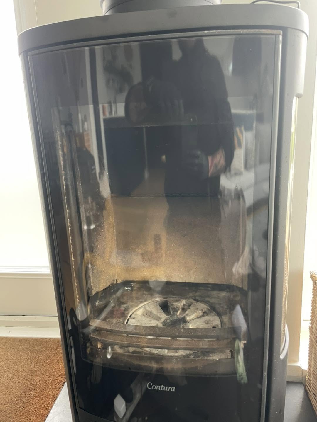 The finished stove with its door closed and the glass clear