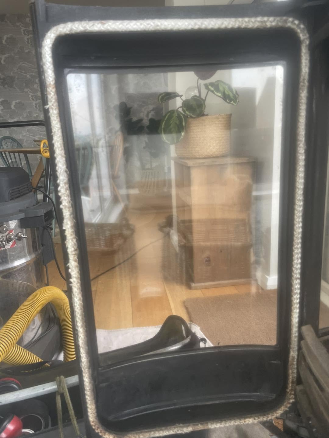 The same stove door with its glass restored clear